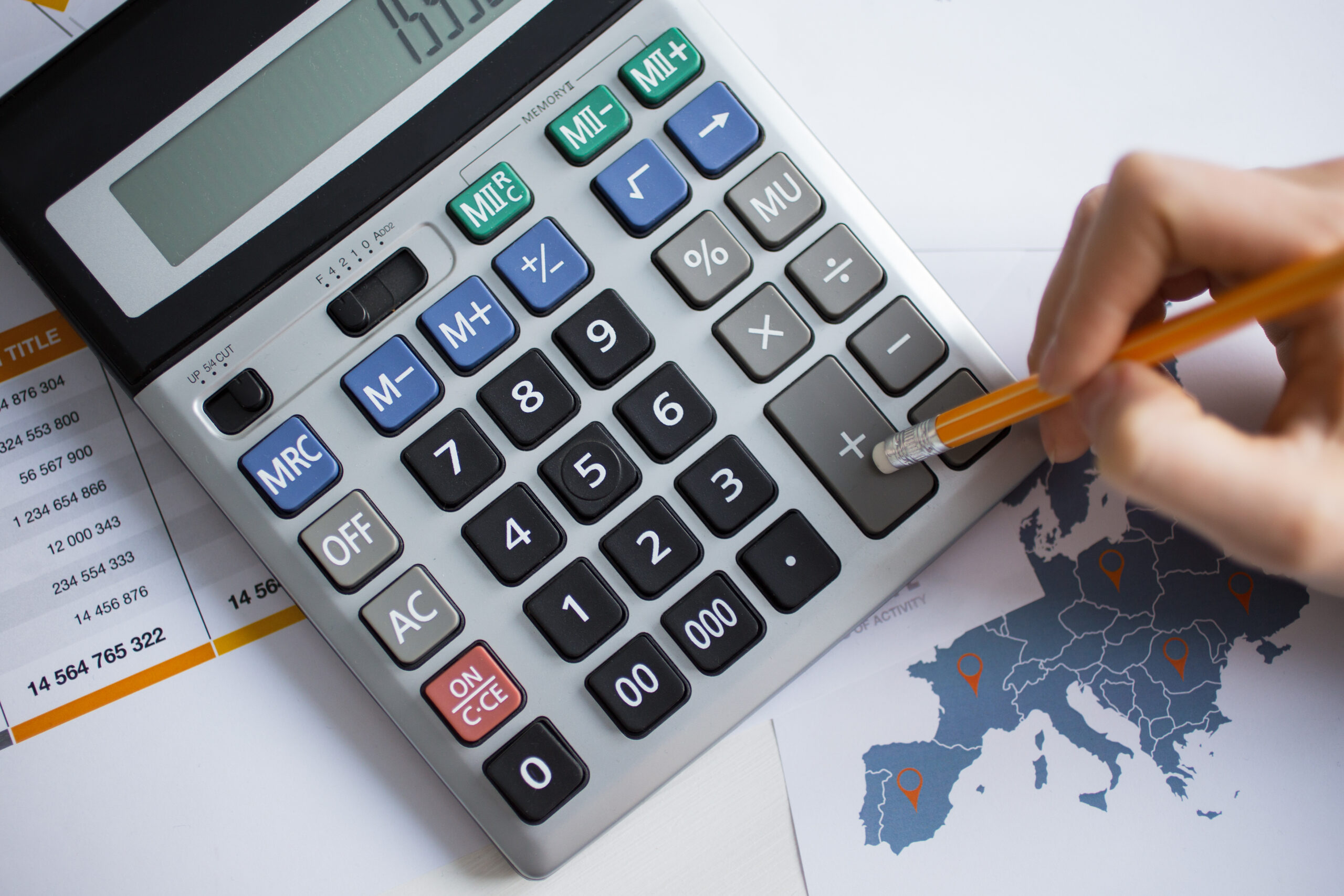 cropped-view-man-hand-working-with-calculator Home