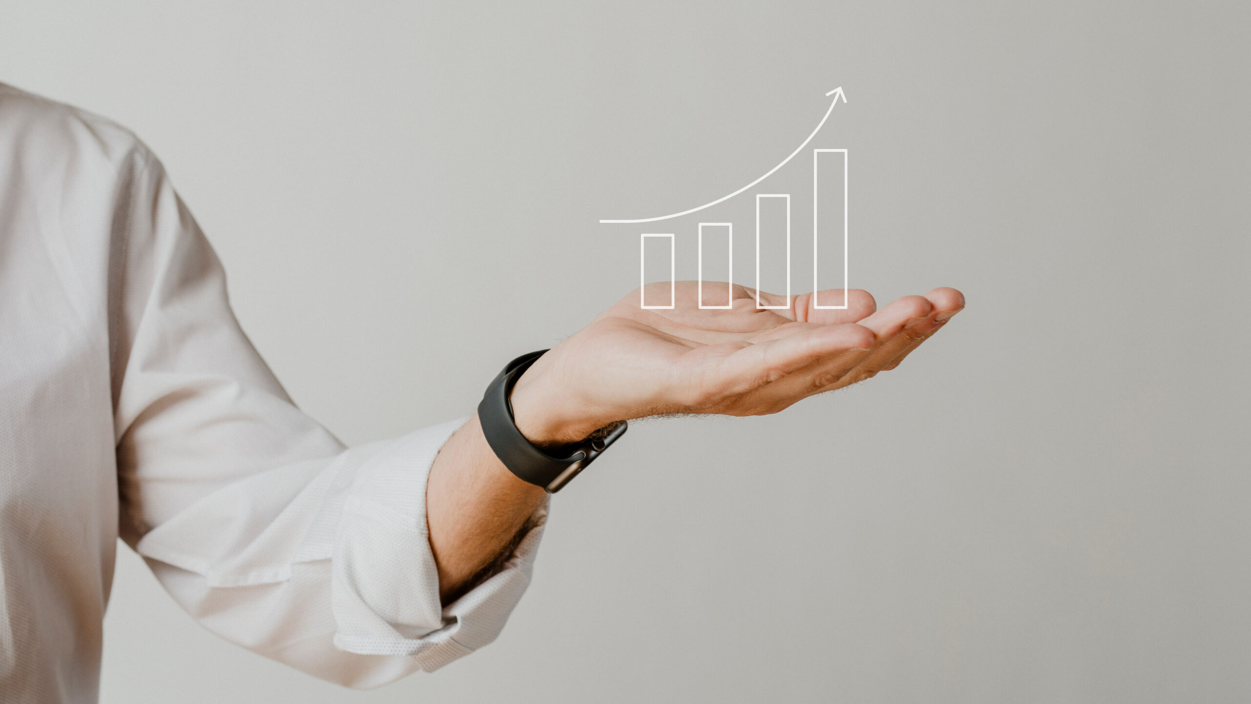 digital-increasing-bar-graph-with-businessman-hand-overlay Home